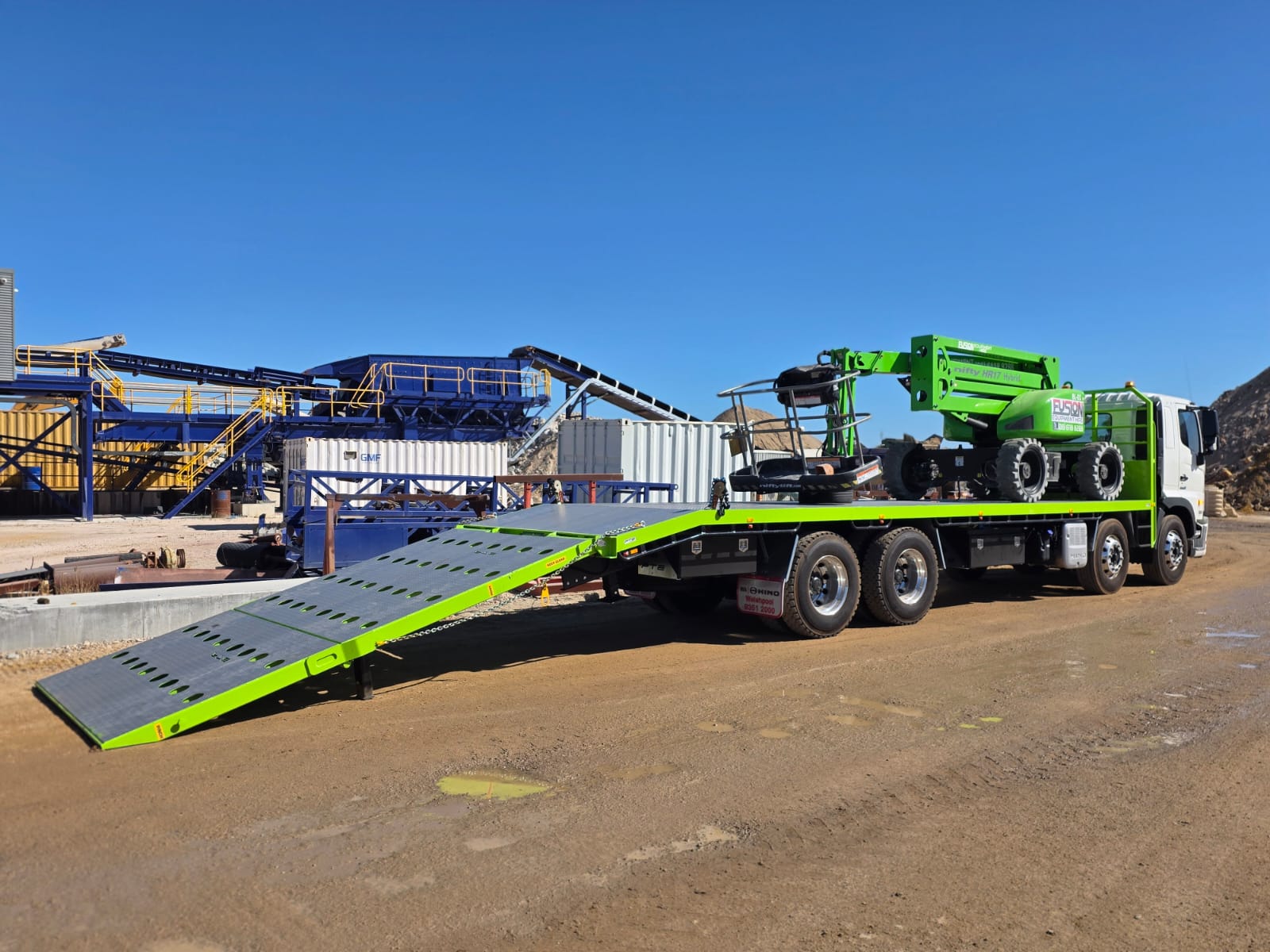 EWP transport on beavertail truck at mine site