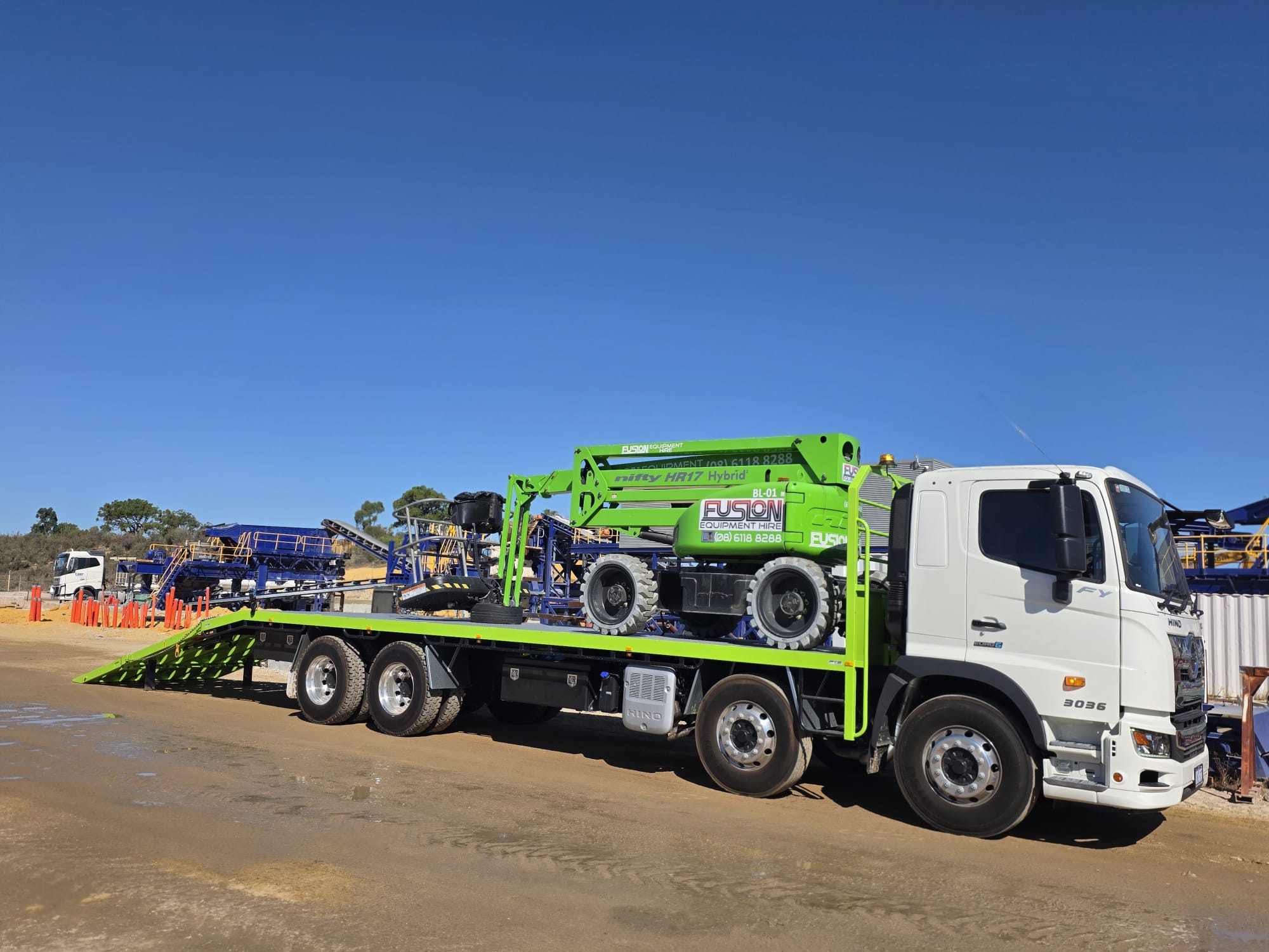 Beavertail truck with elevated work platform at quarry
