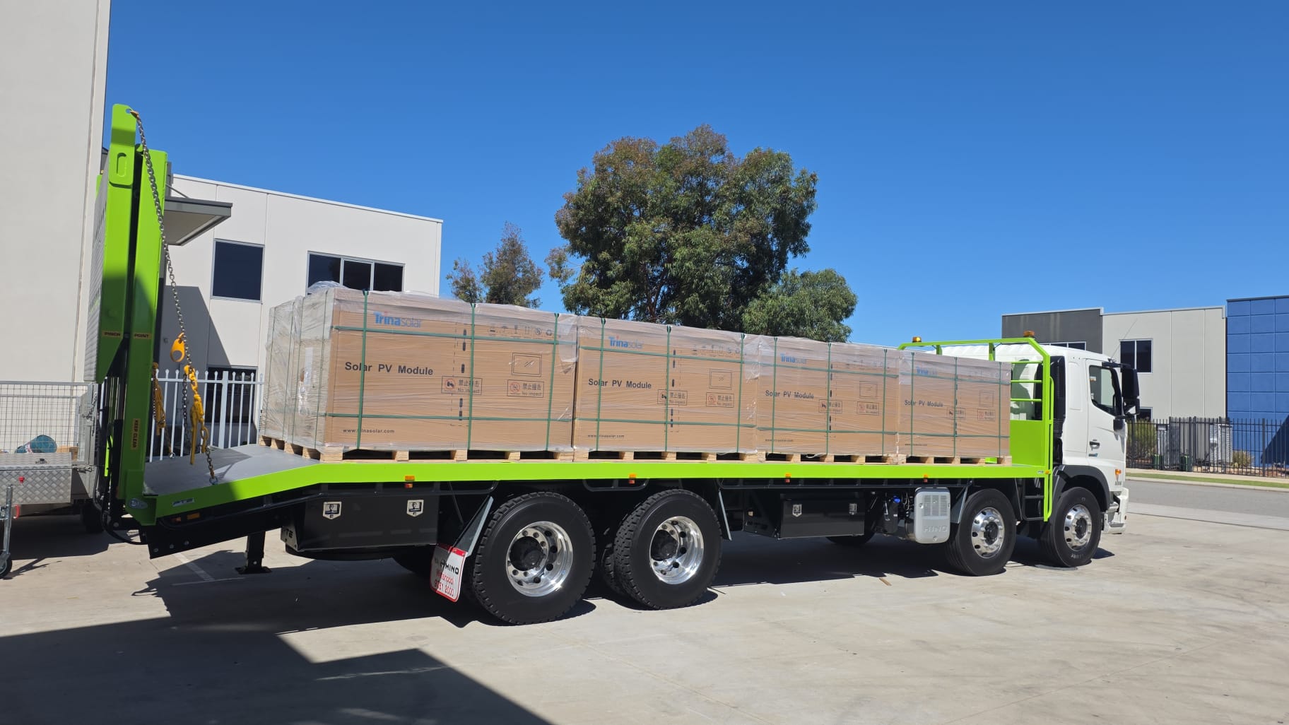 Flatbed truck delivering solar panels