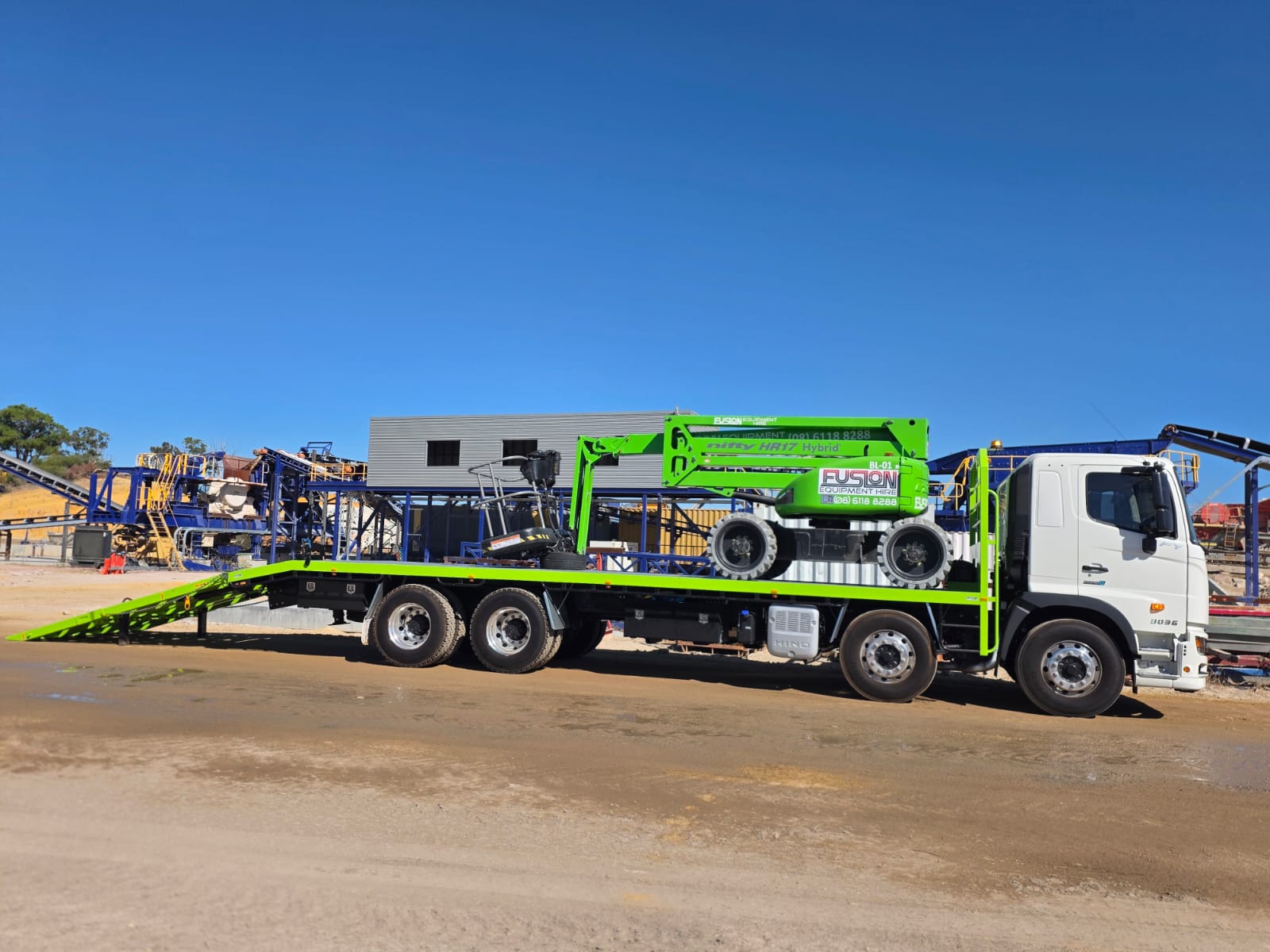 EWP machinery loaded on beavertail at mine site