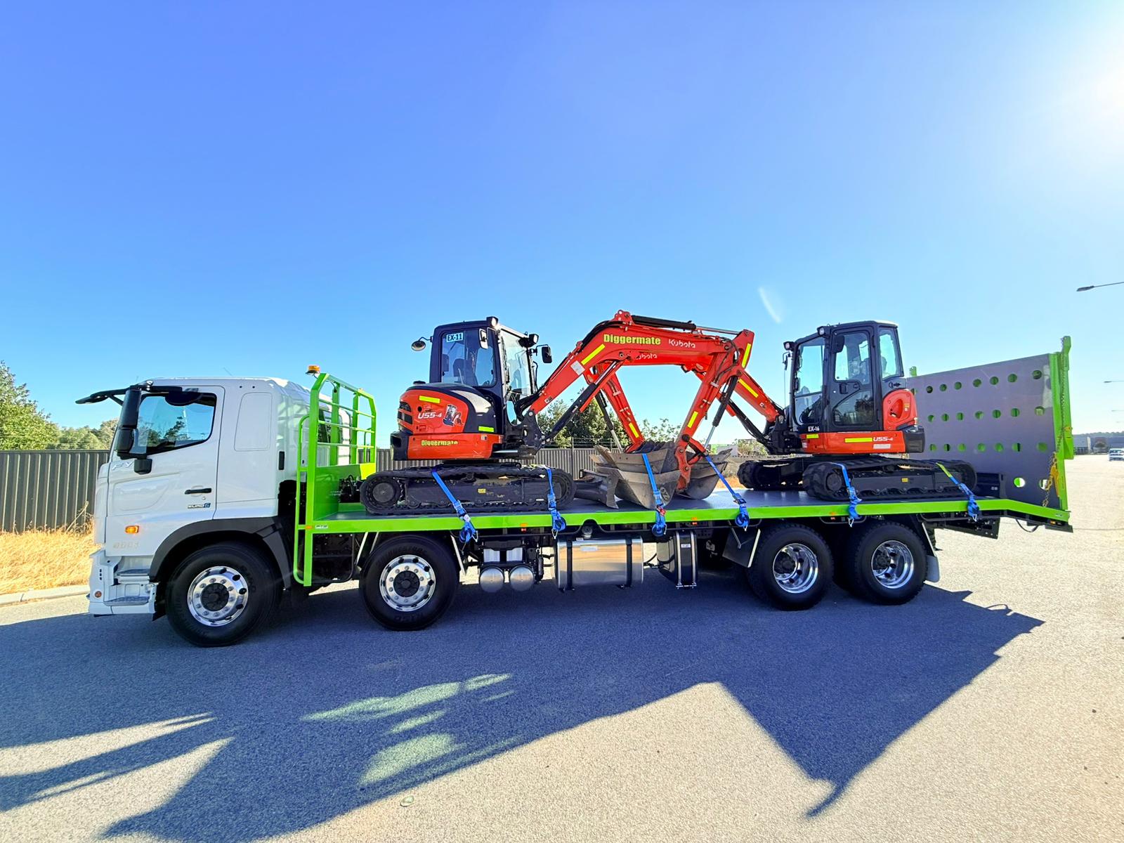 Twin excavator transport on Ozwest beavertail flatbed truck Perth